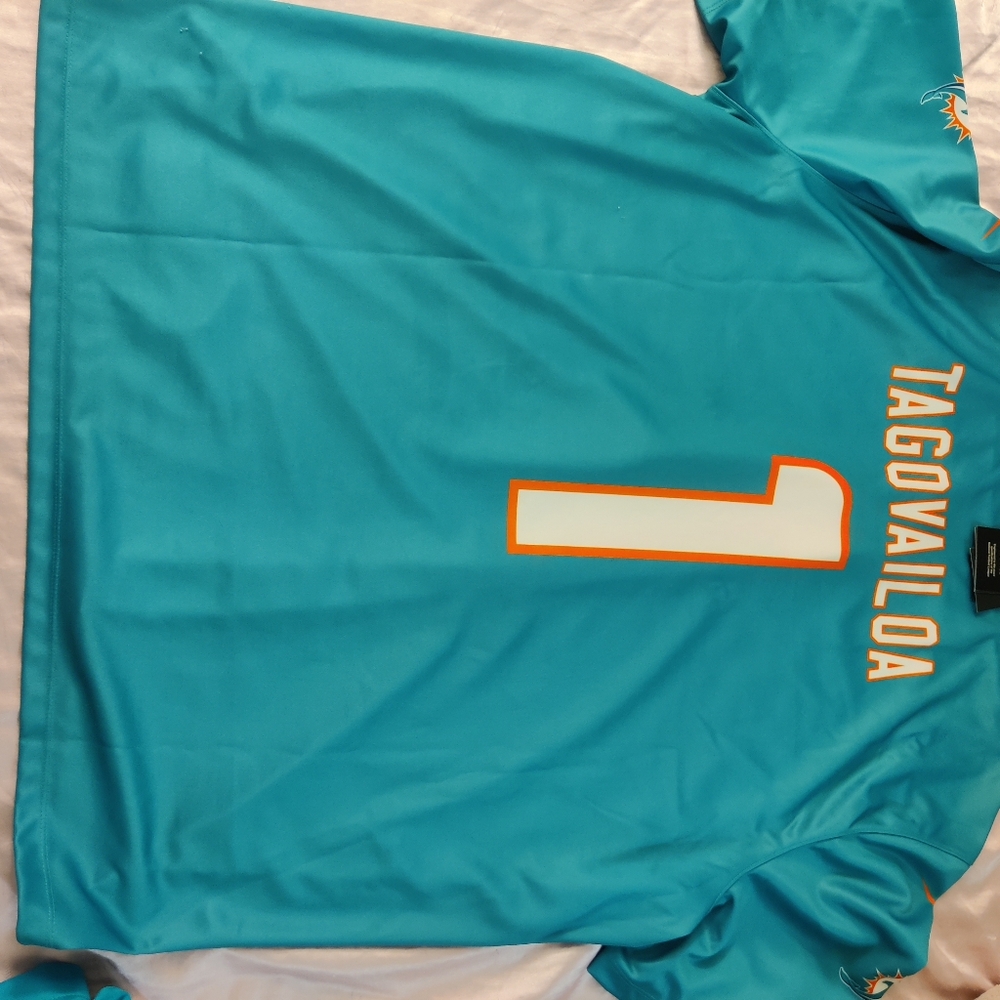 Brand new Miami dolphins jersey with tags .have two available for purchase.#1